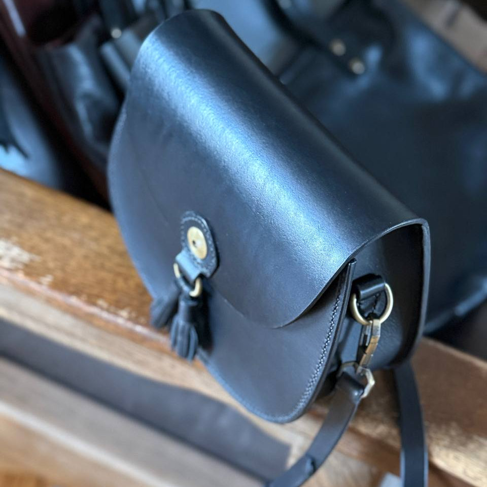 Full‑grain black leather texture close‑up  