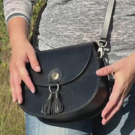 Handmade black leather crossbody bag with brass hardware